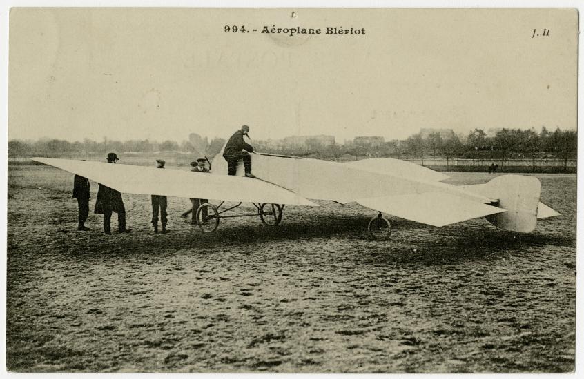 One-half left rear view of the Blériot VII on the ground.