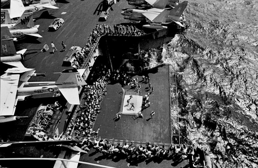 View from above of a live boxing match on an aircraft carrier 