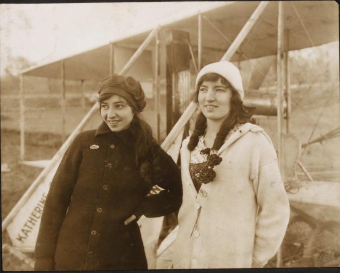 Katherine Stinson (left) and Marjorie C. Stinson (right) posed standing in front of Katherine's Wright Model B, circa 1913 