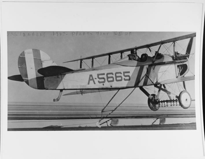 Black and white grainy image of aircraft from the side