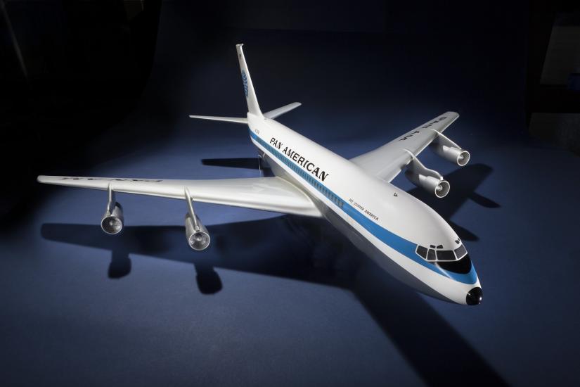 A model of an jet airliner with a long blue stripe down the side. Text above the stripe reads "Pan American."