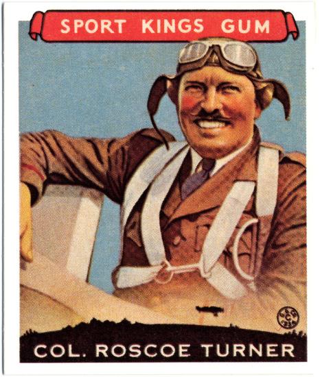 Trading card featuring an illustrated smiling aviator wearing a flying suit, cap, and goggles. The top of the card says Sports King Gum and the bottom says Col. Roscoe Turner.