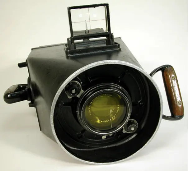 A black camera that is largely one large circular lens. 