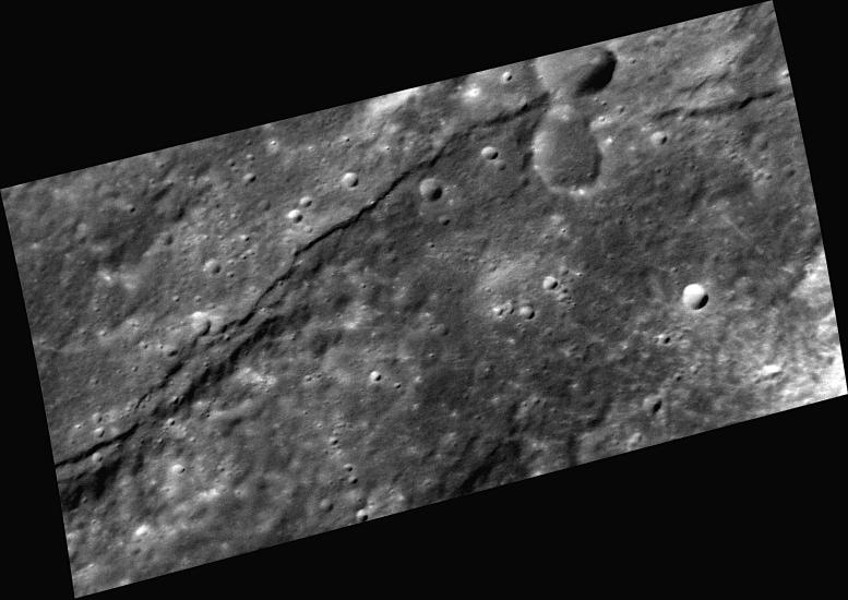 A scarp, or steep cliff, extends horizontally through this image of Mercury's surface.