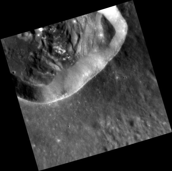 An impact crater where portions of the wall appear slumped or detached. 