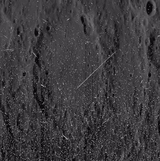 Bright streaks and speckles muddy up an image of Mercury's surface.