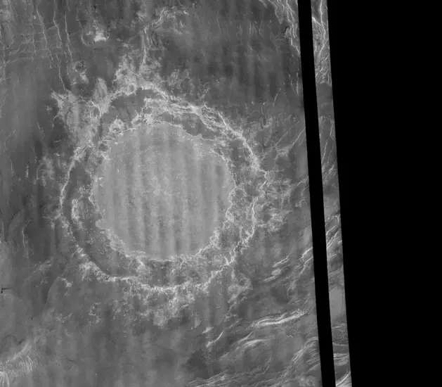 An image of a large impact crater on the surface of Venus.