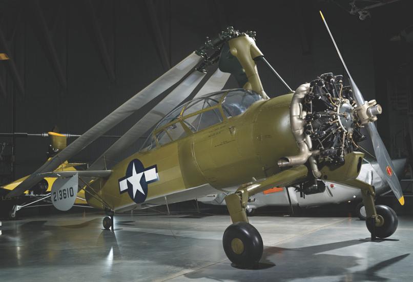 An olive green autogiro with the Air Force symbol on the side. 