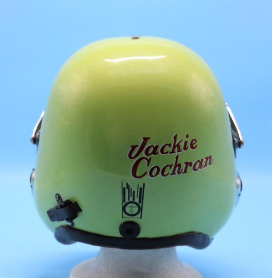 Back of a yellow-green helmet with "Jackie Cochran" written on it