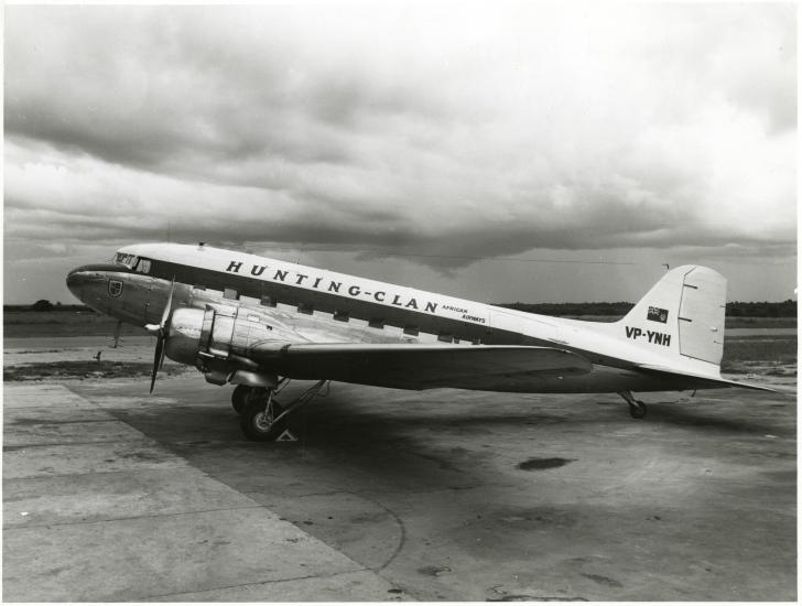 Left side view of a propeller-driven aircraft with the livery of Hunting Clan Airlines.