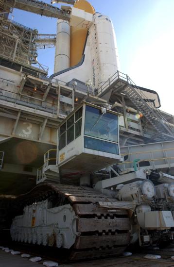 Space Shuttle on a launch pad while on a mobile crawler.