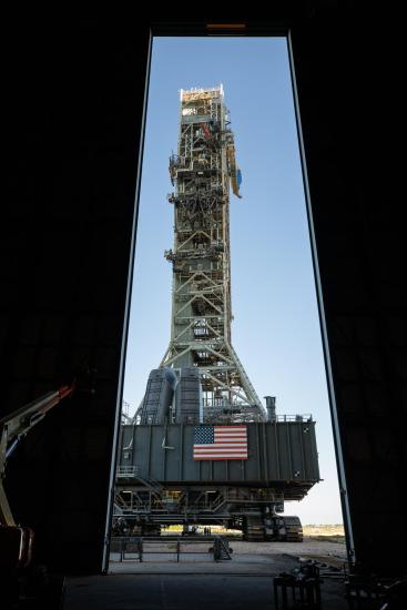 A mobile launcher seen throuigh doors.