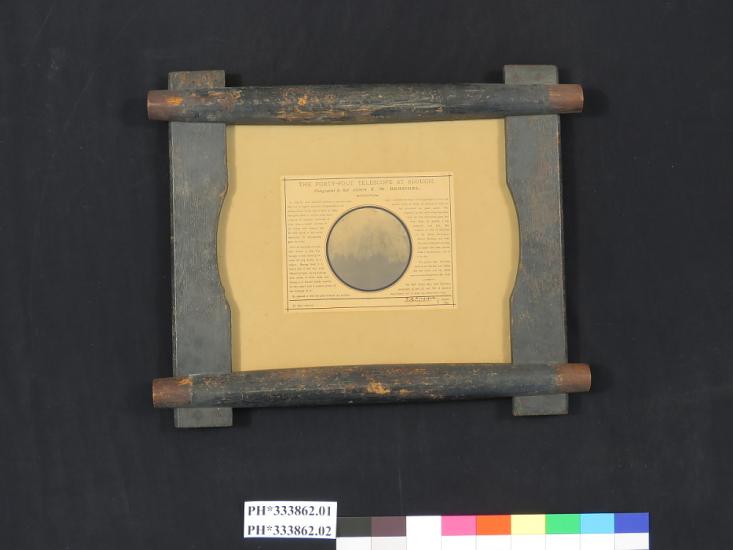 A circular image of a telescope with text around it describing the telescope. The image and accompanying text are mounted on a wooden frame.