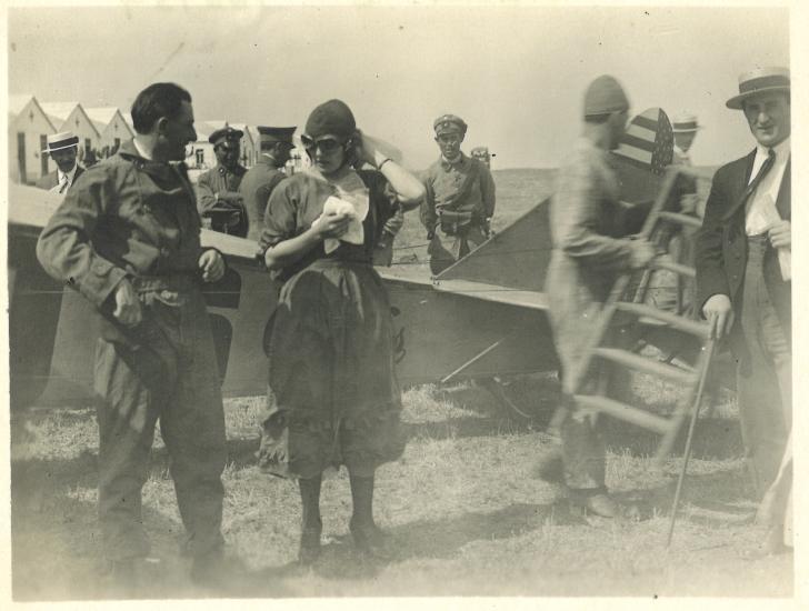 Leon (left) and an unidentified woman chat after a flight, undated.