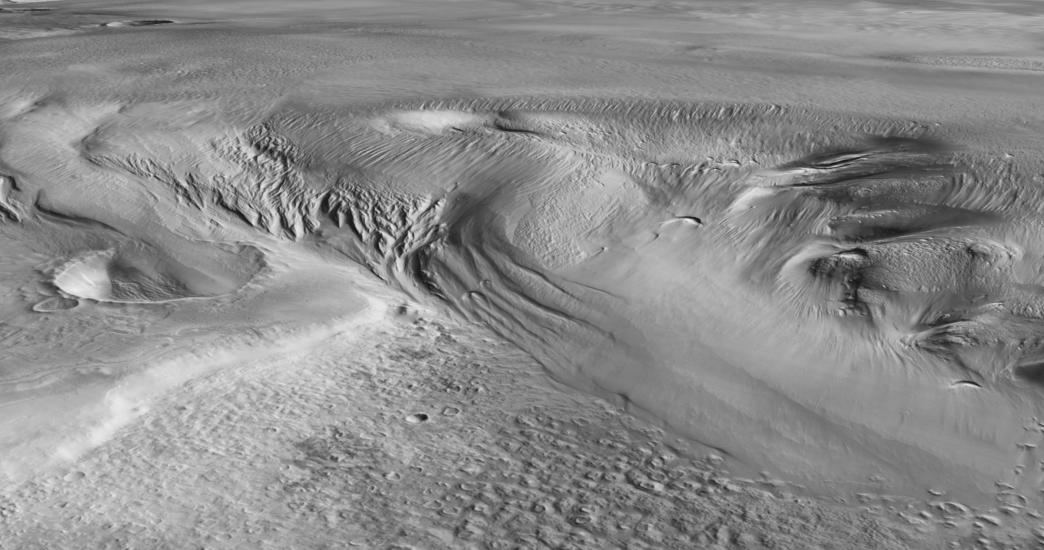 A grayscale image of the surface of mars, showing a textured surface. 