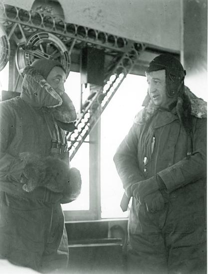 Portrait of Cmdr. J. H. Klein, U.S. Navy, and Capt. E. T. Pollock, U.S. Navy, in the control car of U.S. Navy airship ZR-3 Los Angeles after observation of an eclipse in 1925.