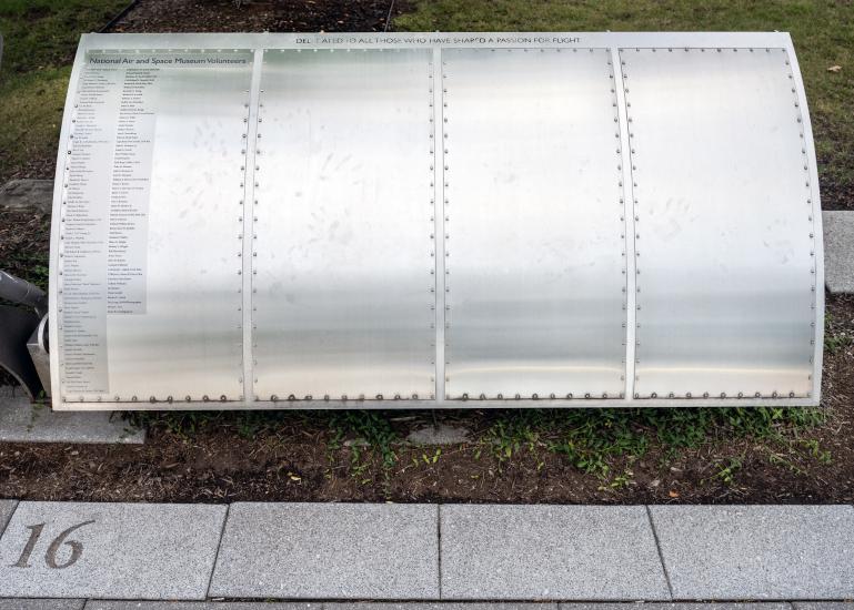 Names written on silver metal panel outside Hazy center.