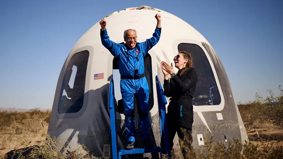 Ed Dwight exits the New Shepard capsule after completing his flight to space.