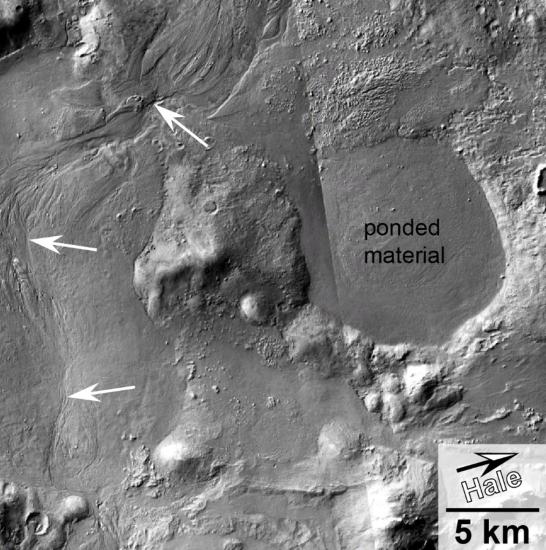 A crater on Mars with annotated texts and arrows on the image