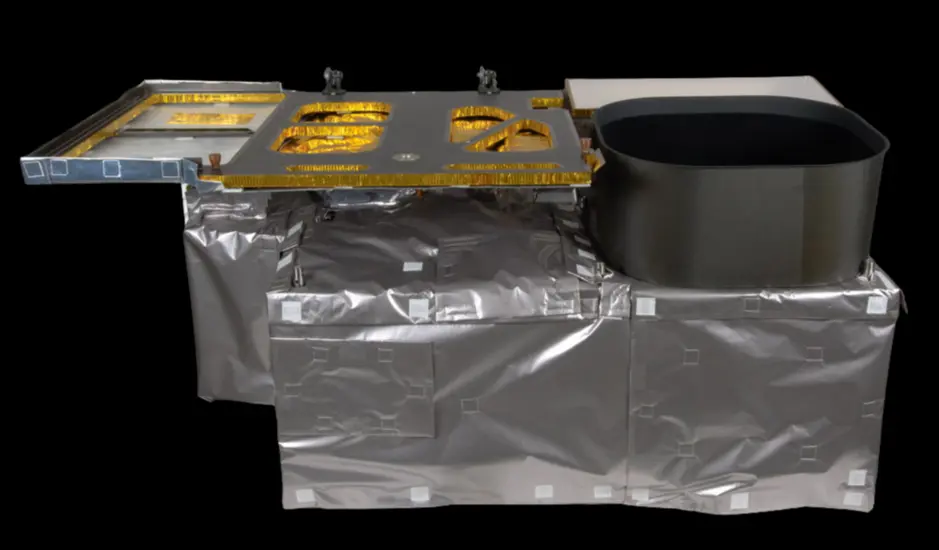 A boxy object with a mostly silver metallic surface that also features some gold.