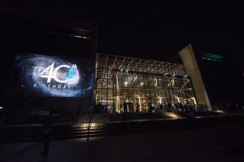 Image of the building with a projection on the exterior. 