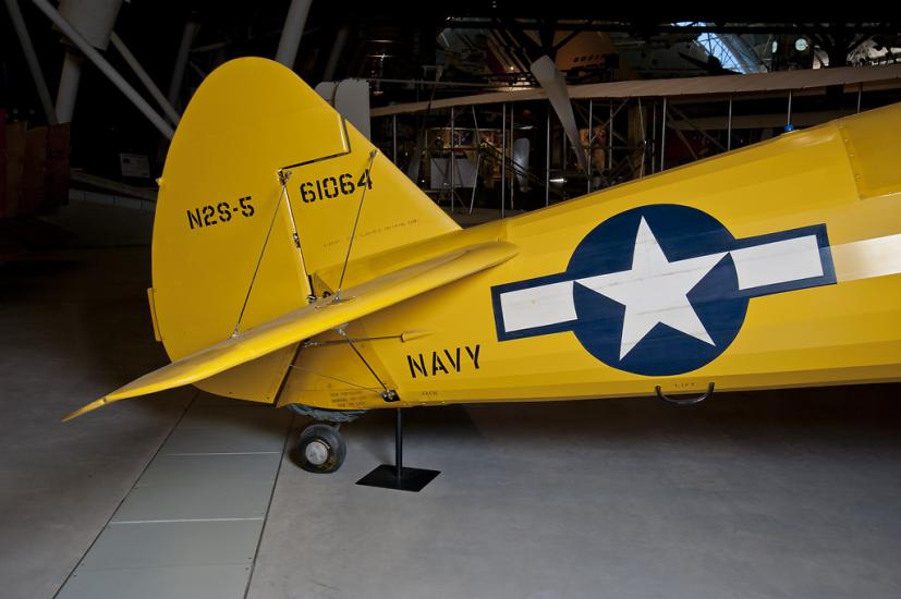 Yellow painted vertical stabilizer of an aircraft. 