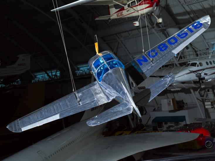 Top rear view of a metal plane hanging in the museum. 