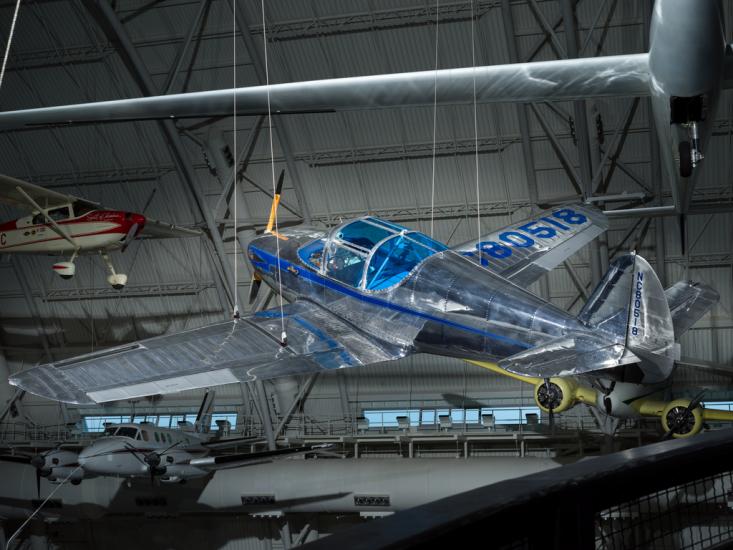 Rear view of a silver painted plane hanging in the museum. 