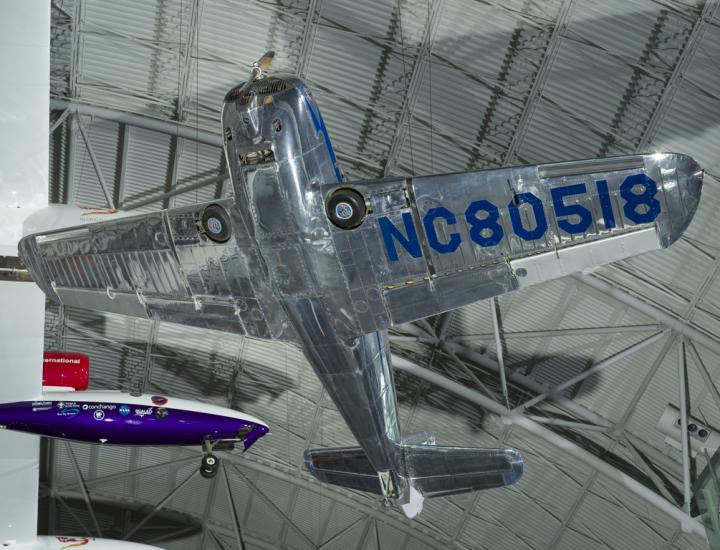 Underbelly of a silver painted plane. 