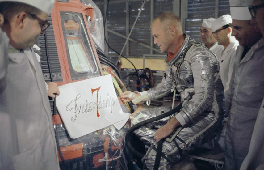 Astronaut John Glenn Inspecting the Placement of the "Friendship 7" Name