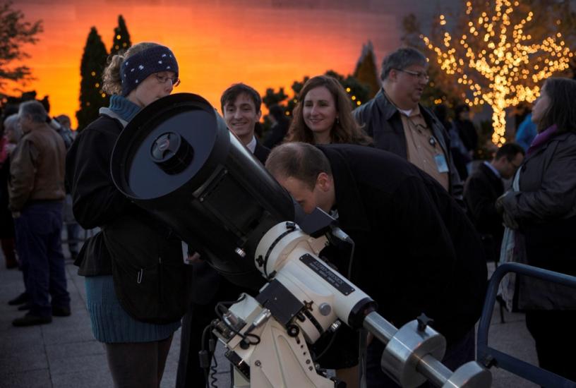 Visitors observe a lunar eclipse in 2014 using telescopes at the Smithsonian National Air and Space Museum