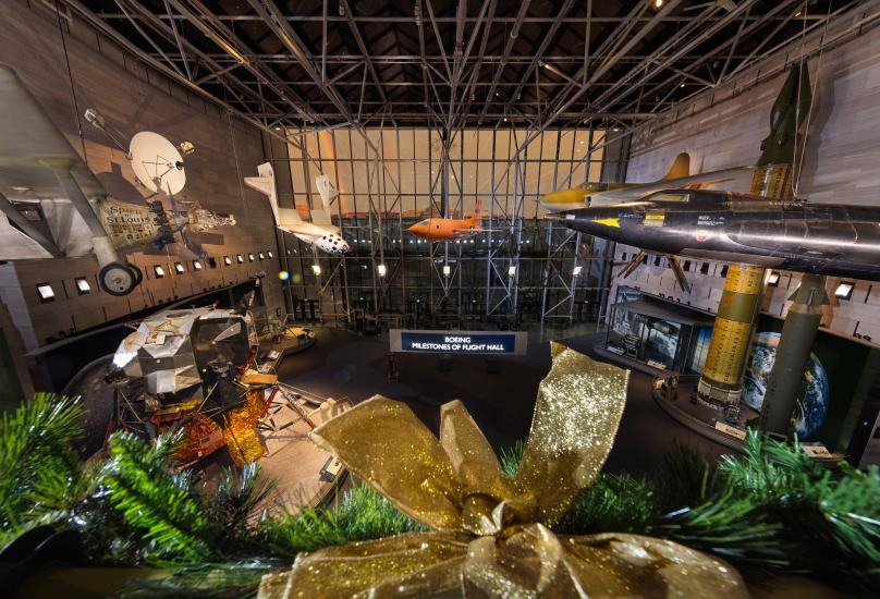 Image of the Museum's entry gallery from the second floor. A rainbow can be seen outside. 