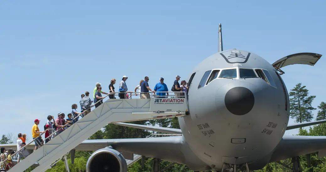 Visitors line up to get into military aircraft