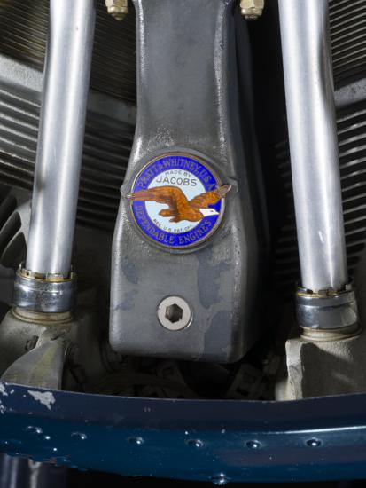 Close up view of a Pratt & Whitney logo on a propeller attached to an engine of a plane.