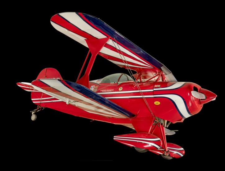 Red, white, and blue painted aerobatic biplane. 