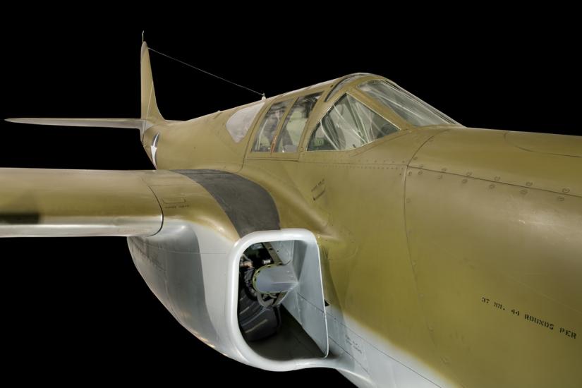 Close up view of the cockpit and intake valve of a jet plane.