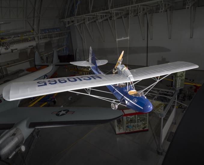 Blue and silver painted aircraft hanging in the museum. 