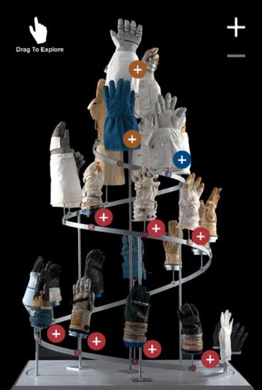 Screenshot of an interactive activity featuring a helix display of various space gloves.