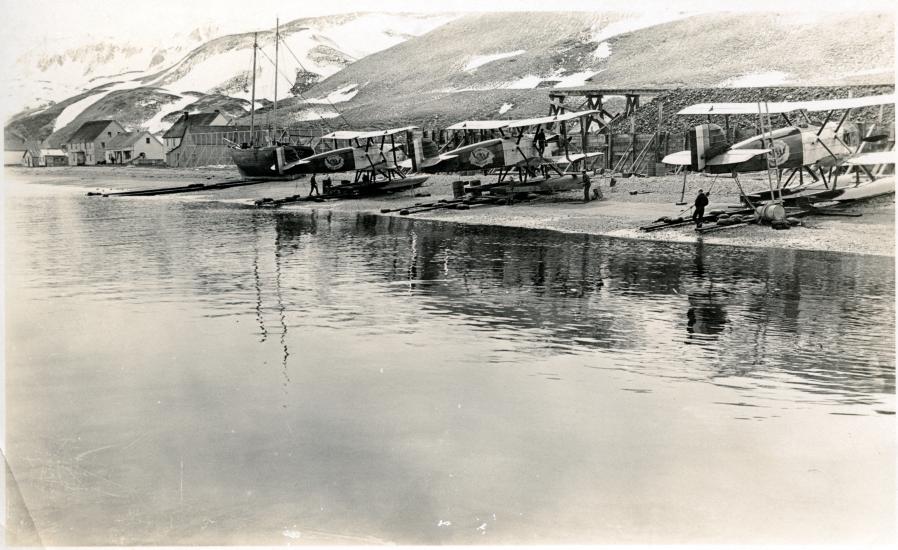 A view of the three remaining Douglas World Cruisers parked on a shore belonging to Alaska.