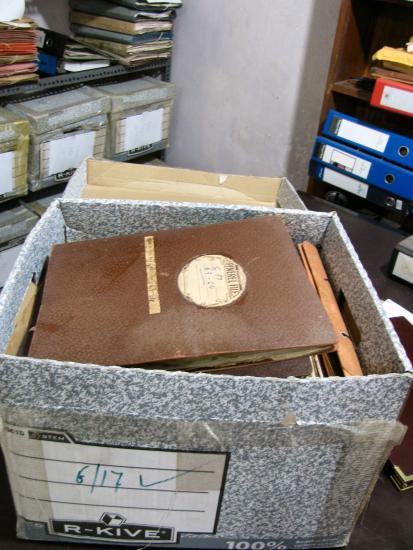 Open box of various items belonging to author Arthur C. Clarke.