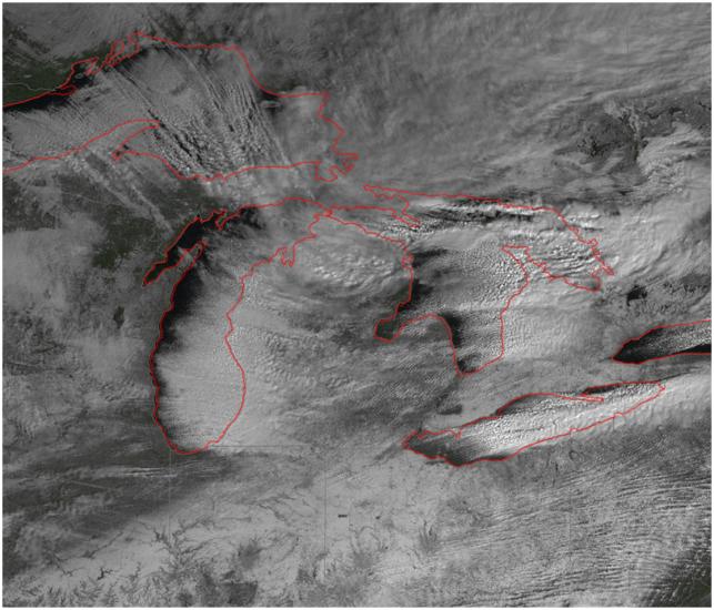 Satellite image of snowfall around the Great Lakes region of the United States and Canada.