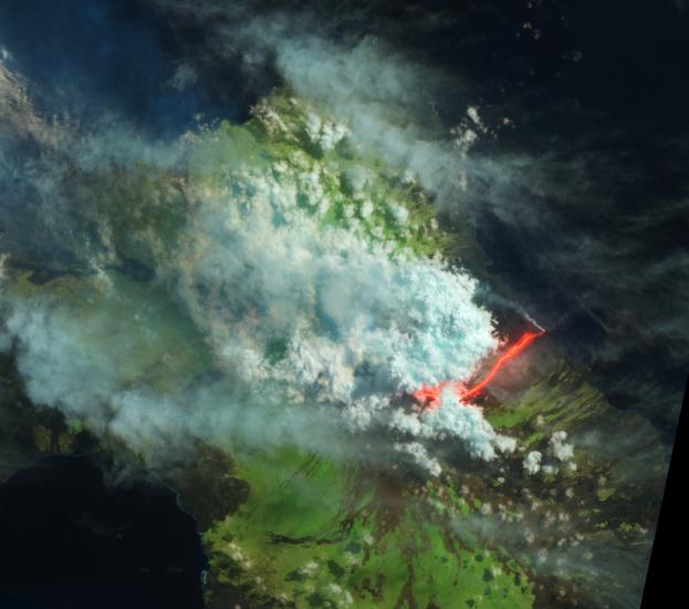 Satellite view of an erupting volcano in the Galapagos Islands. The view has been edited to show different colors which represent different aspects of the photo.