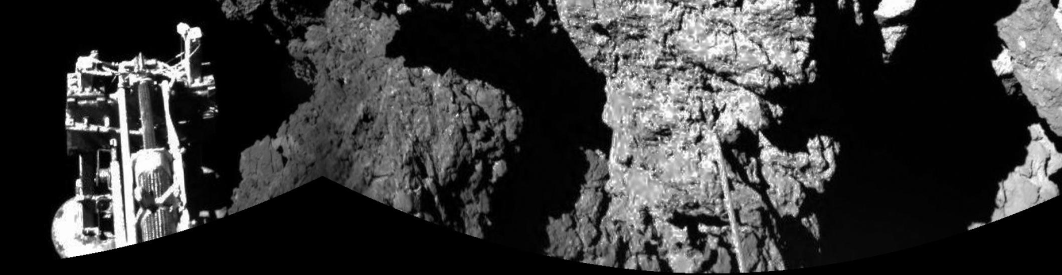 A spacecraft on the left that is intended for research on a comet is stationary.