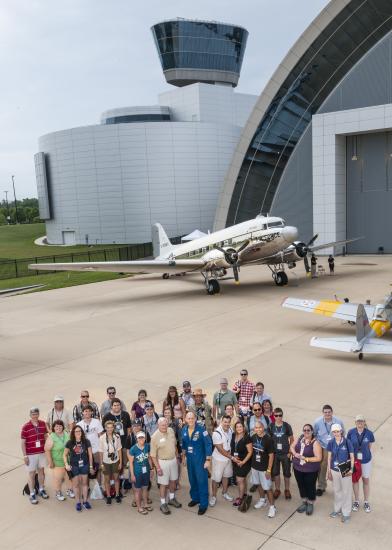 Group photo of social media participants, social media staff members of the Museum, the Museum's former director, and astronaut Clay Anderson outside together during a flight-themed Museum event.