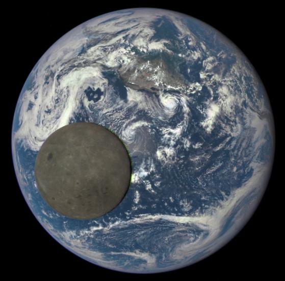 A view of the dark side of the Moon as the Moon passes Earth in front of an observatory spacecraft.