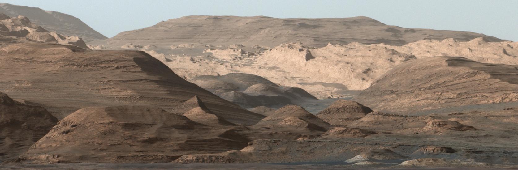 Panoramic view of a higher-altitude mountain landscape on Mars.