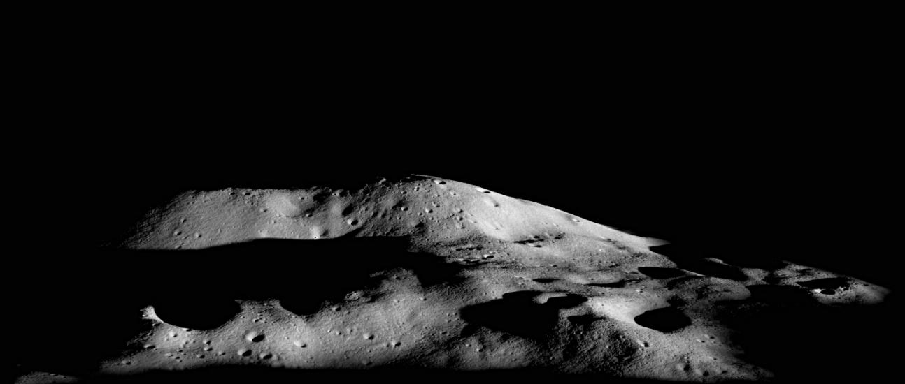 A tall mountain summit on one of the Moon's polar regions that receives some sunlight due to its impressive height.