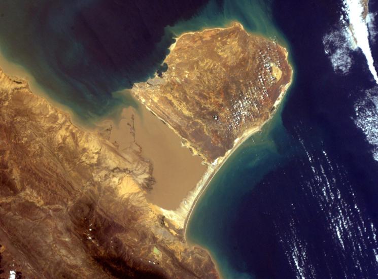 Satellite view of a peninsula with brown ground on the coast of Venezuela. 