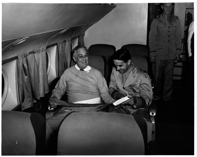 U.S. President Franklin Roosevelt sits in a plane seat as the first U.S. president to fly in a plane.