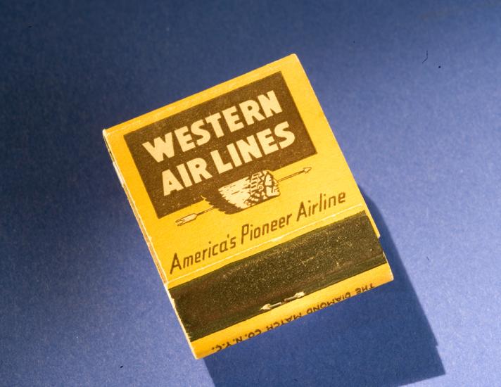 Matchbook with yellow background and brown Western Air Lines logo on cover. 